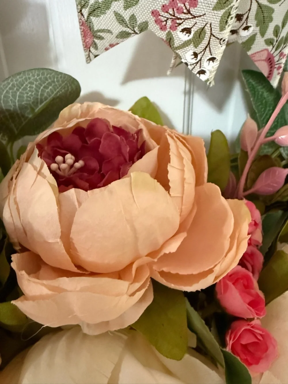 Pink & Cream Floral Wreath with Patterned Bow, measuring 23 x 23”